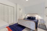 Second bedroom presents a queen-sized bed -ideal for couples-